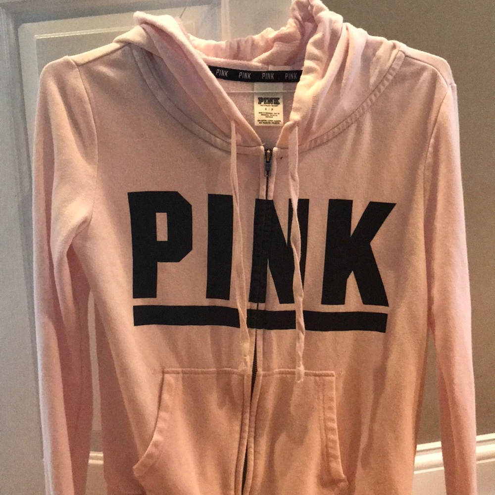 VS Pink zip-up sweatshirt.